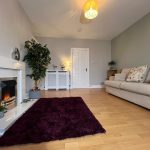 Anderson Road - front living room. Wooden flooring and walls painted in neutral colours.